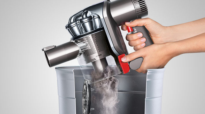 The Dyson DC44 Car and Boat cordless vacuum cleaner. Hygienic bin emptying. Just push the button to release the dirt.