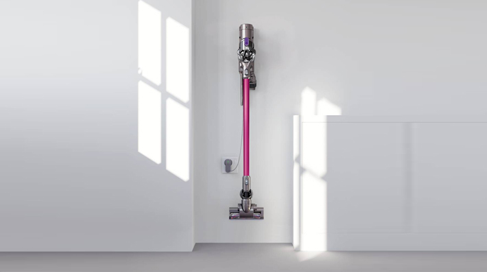 The Dyson DC44 Multi Floor cordless vacuum cleaner. Convenient docking station. Stores and charges the machine, and holds additional attachments.