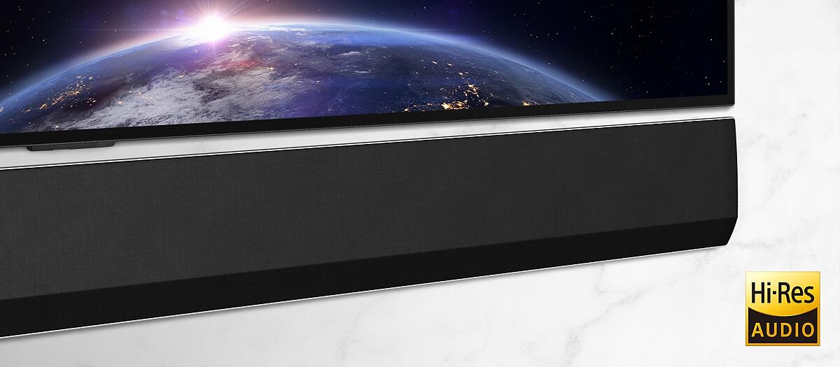 A mid-shot of the the right side of the LG Soundbar. The TV shows an image of space.