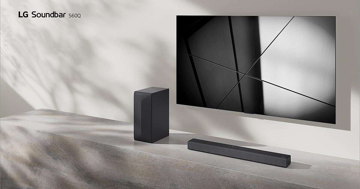 LG Soundbar S60Q and LG TV are placed together in the living room. The TV is on, displaying a geometric image.